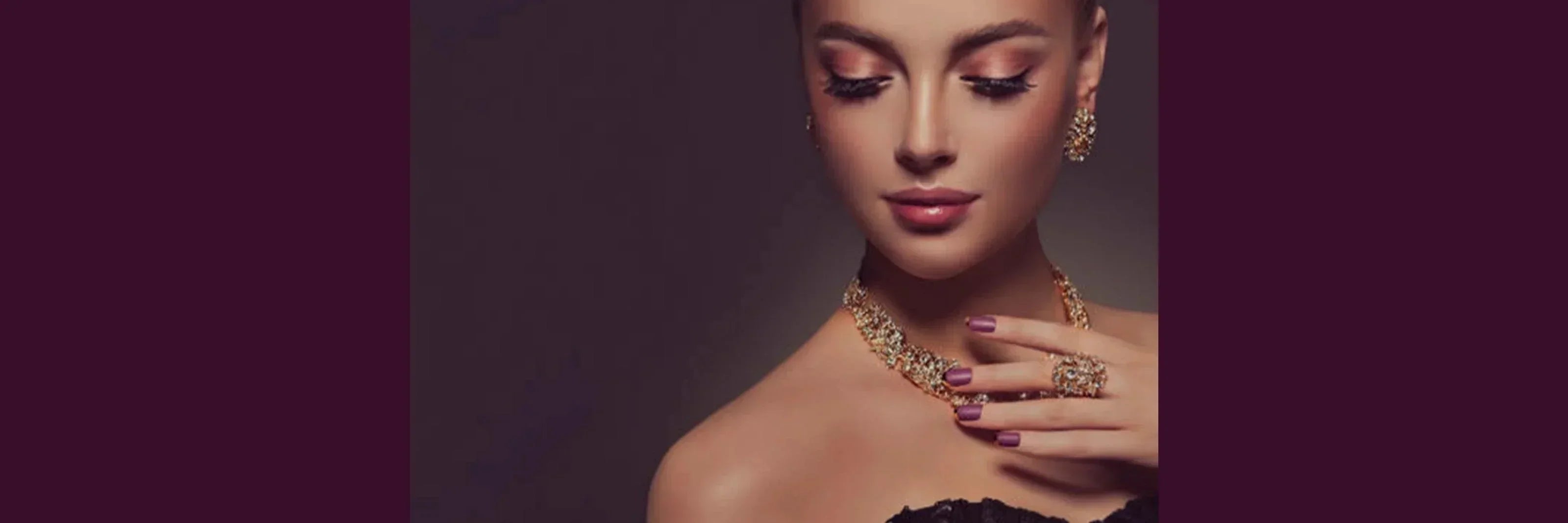 Woman wearing gold-plated necklace, earrings, and ring, showcasing elegant jewelry set