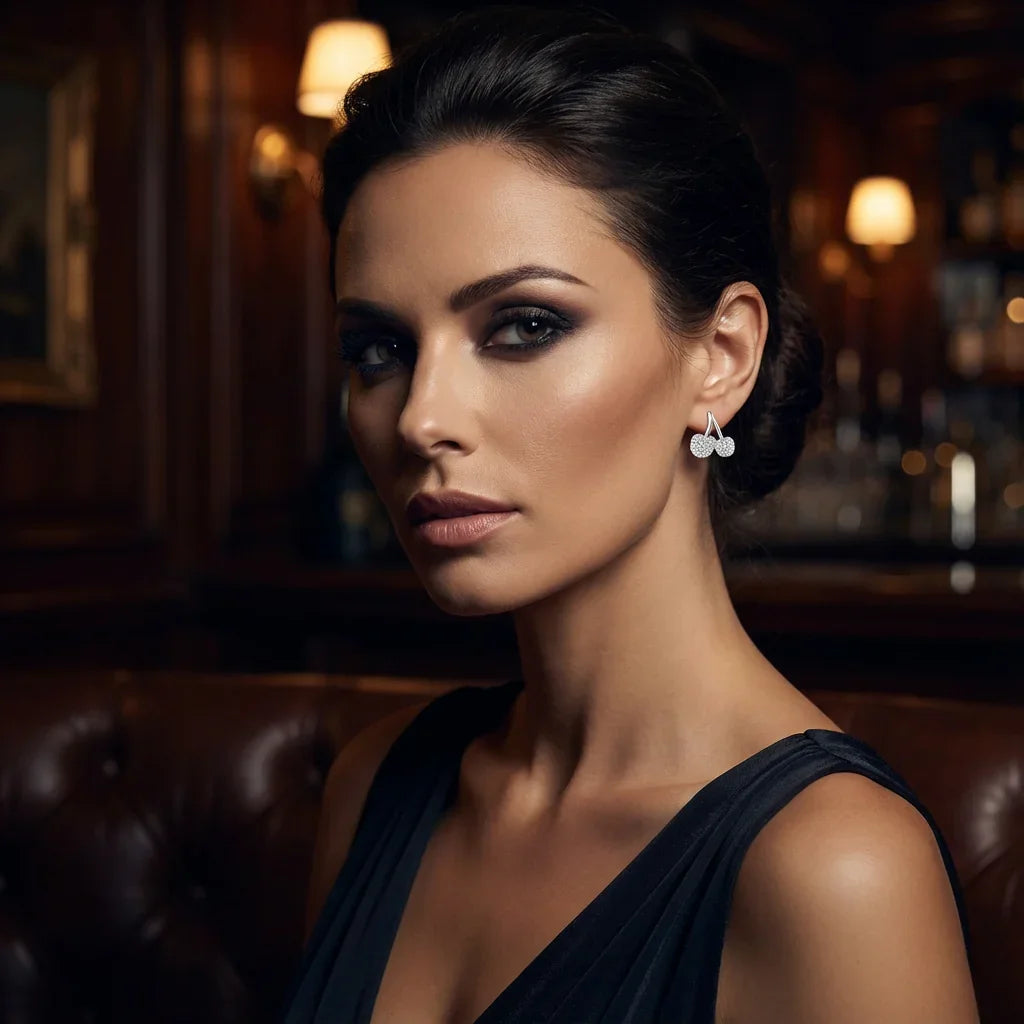 Elegant woman wearing 925 silver earrings in a sophisticated, dimly lit setting