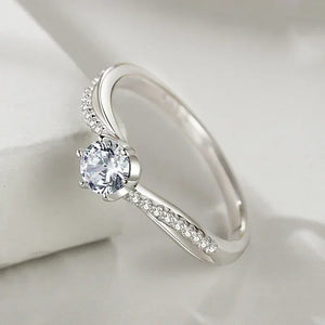 Elegant sterling silver ring with round center stone and pavé-set accent stones