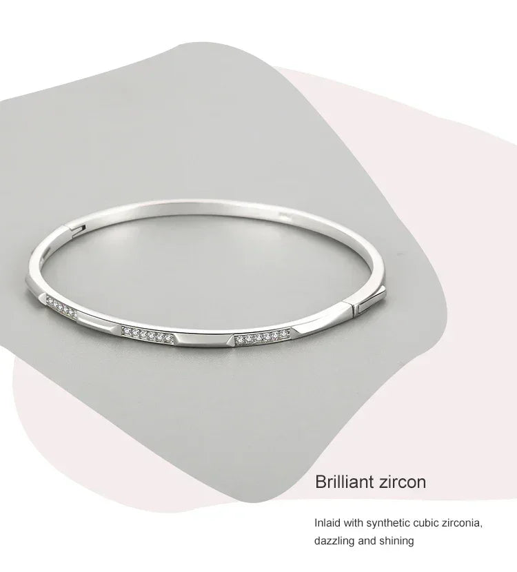 Elegant 925 silver bangle bracelet with synthetic cubic zirconia stones, minimalist design