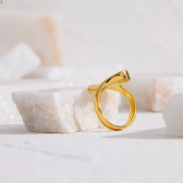 18K gold-plated abstract statement ring with modern sculptural design on white background