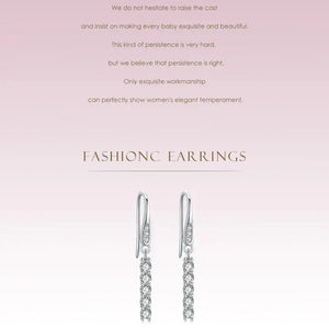 Silver chain earrings on a light pink background with text
