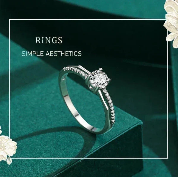 925 silver ring with round solitaire center and pavé set stones on split band