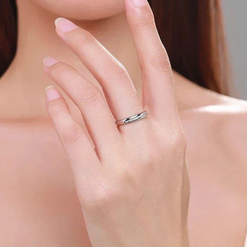 Woman wearing minimalist 925 silver ring on hand, simple elegant jewelry style