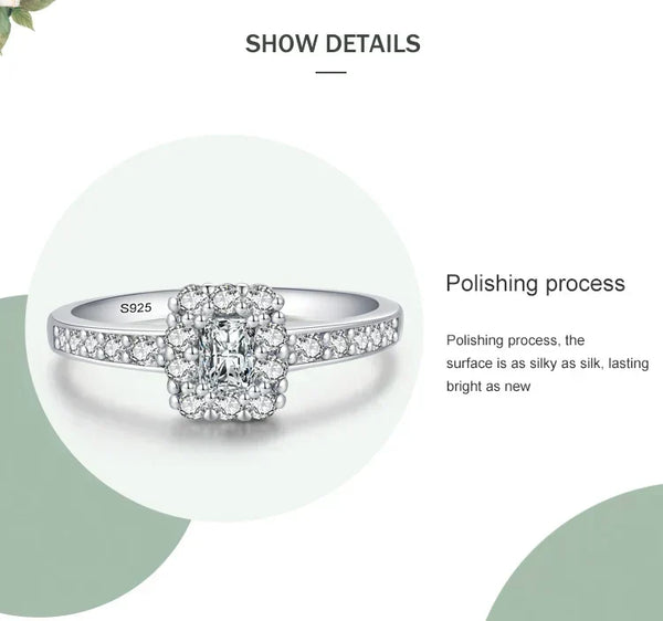 Silver ring with diamond details on a white background