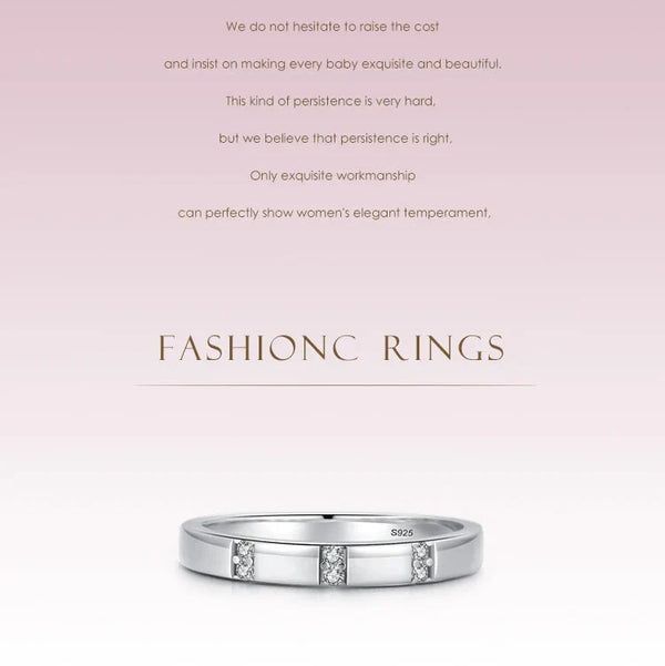 Silver ring with diamonds on a light pink background with text about craftsmanship.