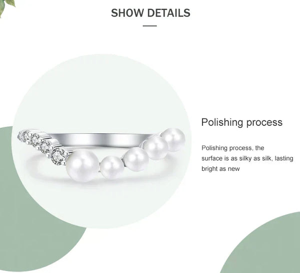 Silver ring with pearls on a white background