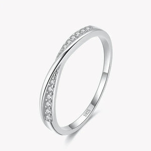Sterling silver ring with double row of small clear gemstones on white background