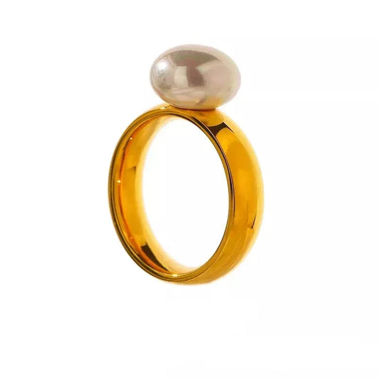 18K gold-plated ring with a single oval white pearl on a white background