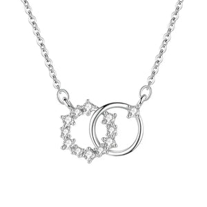 Silver necklace with interlocking heart and circle pendants on a white background