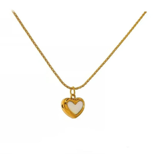 Gold-plated heart pendant necklace with white enamel on a delicate chain, elegant jewelry
