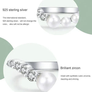 925 sterling silver ring with pearls and sparkling cubic zirconia accents on white background