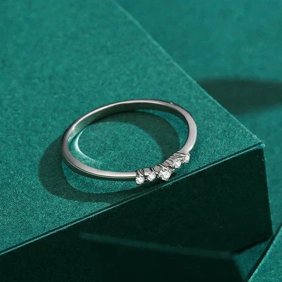 Silver ring with small diamonds on a green textured surface-TM & CO. JEWELS 