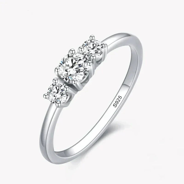 Sterling silver ring with three round clear stones on a simple band, jewelry for women