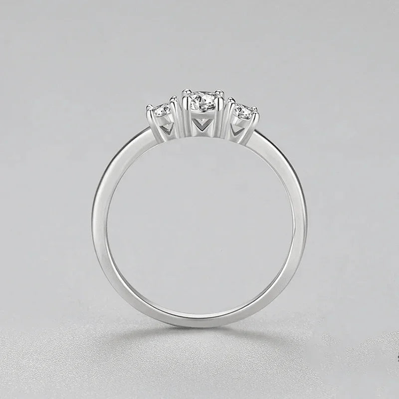 Sterling silver ring with three round clear stones on a simple band, jewelry for women