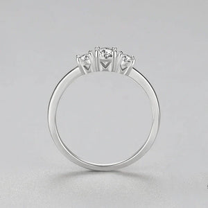 Sterling silver ring with three round clear stones on a simple band, jewelry for women