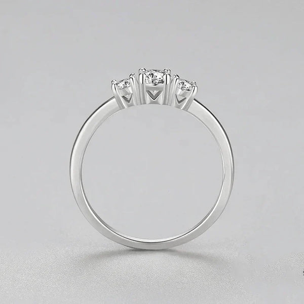 Sterling silver ring with three round clear stones on a simple band, jewelry for women
