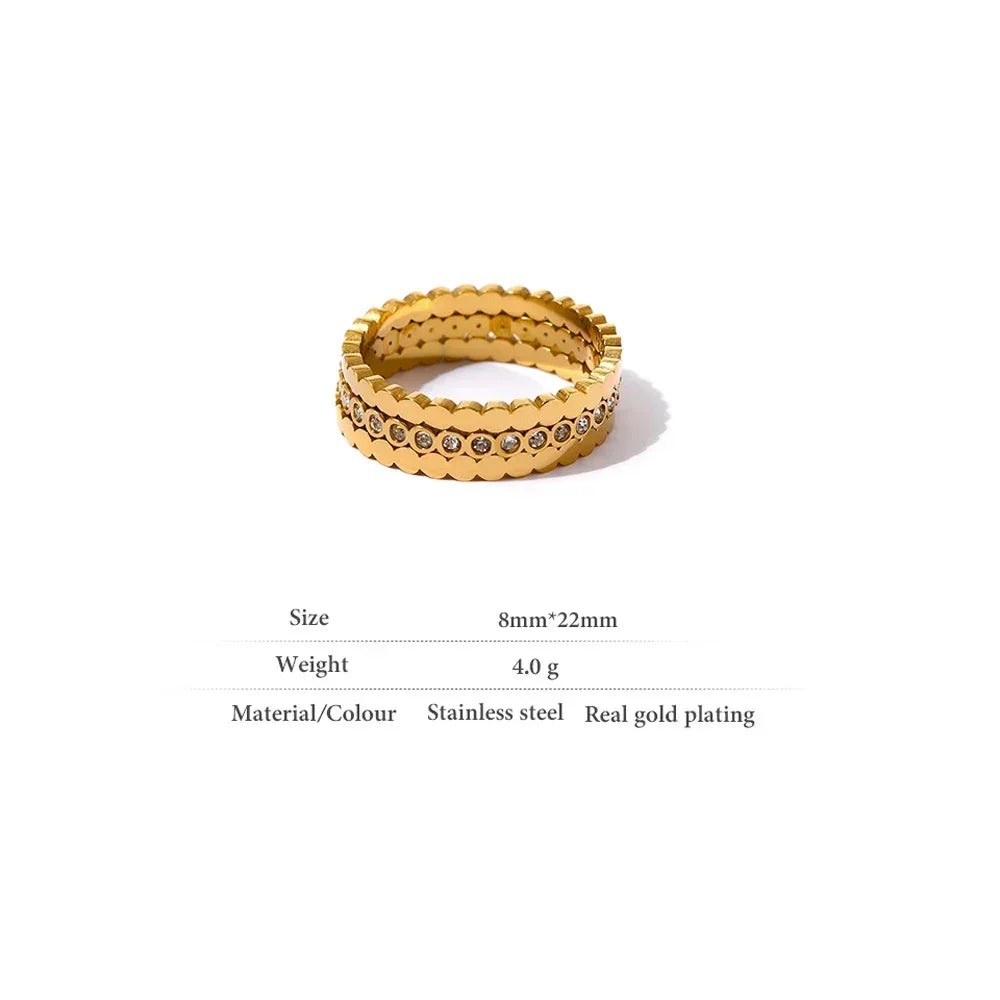 Gold-plated stainless steel stacking rings with crystal accents, minimalist jewelry.