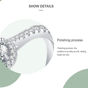 Sterling silver ring with round center cubic zirconia and pavé band on white background