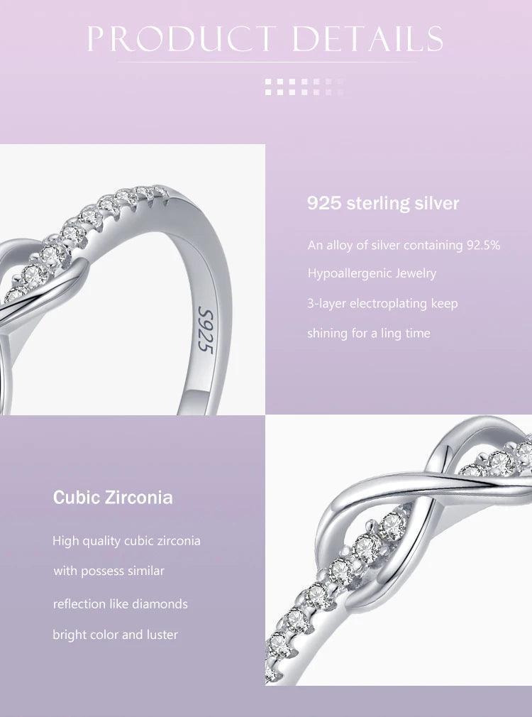 925 sterling silver ring with cubic zirconia stones, infinity design on pastel background