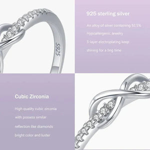 925 sterling silver ring with cubic zirconia stones, infinity design on pastel background