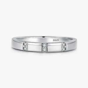 Sterling silver 925 ring with three sets of small clear gemstones, minimalist design