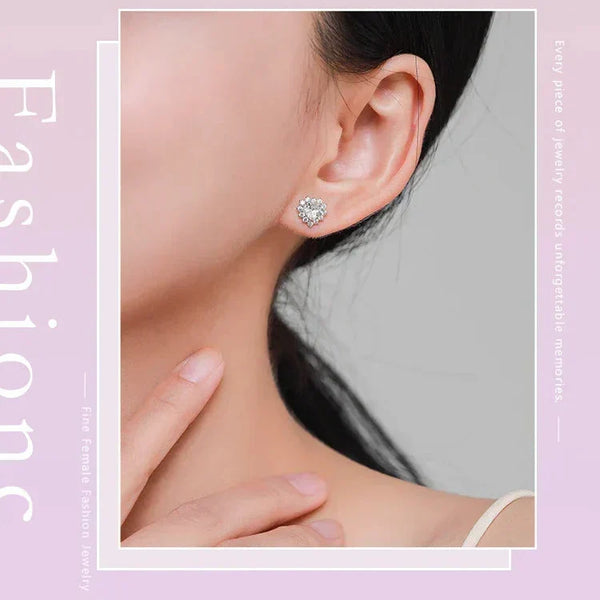 Close-up of a person wearing a diamond earring with a soft pink background and text about jewelry.