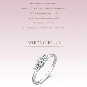 Silver ring with diamonds on a light pink background with text about craftsmanship.