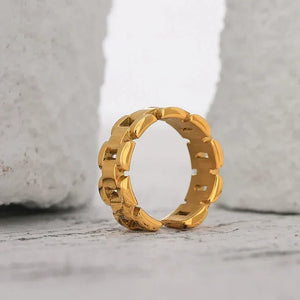 18K gold-plated open band ring with modern geometric chain design on white background