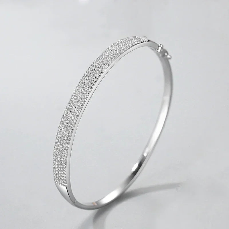 925 silver bangle bracelet with pavé crystals on a light background