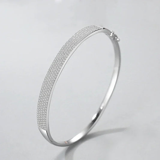 925 silver bangle bracelet with pavé crystals on a light background