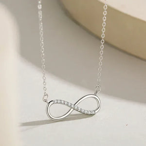 Silver infinity necklace on a light background-Forever Linked Pendant - TM & Co. Jewels