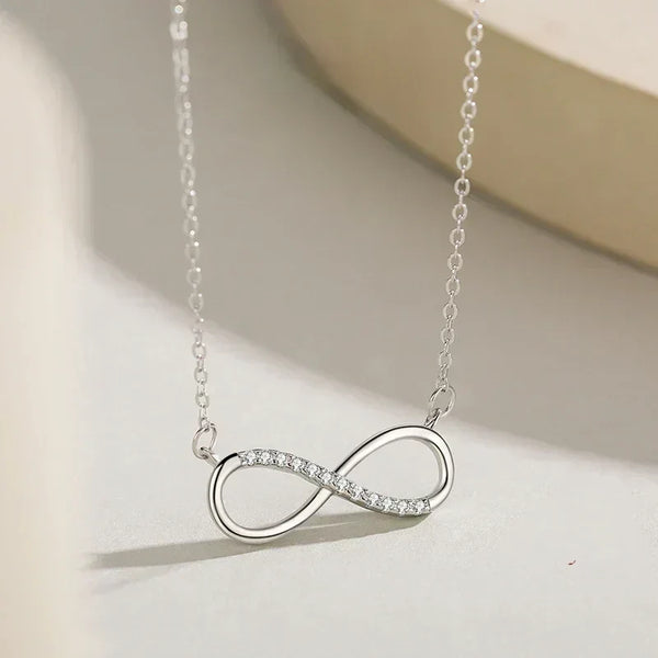 Silver infinity necklace on a light background-Forever Linked Pendant - TM & Co. Jewels