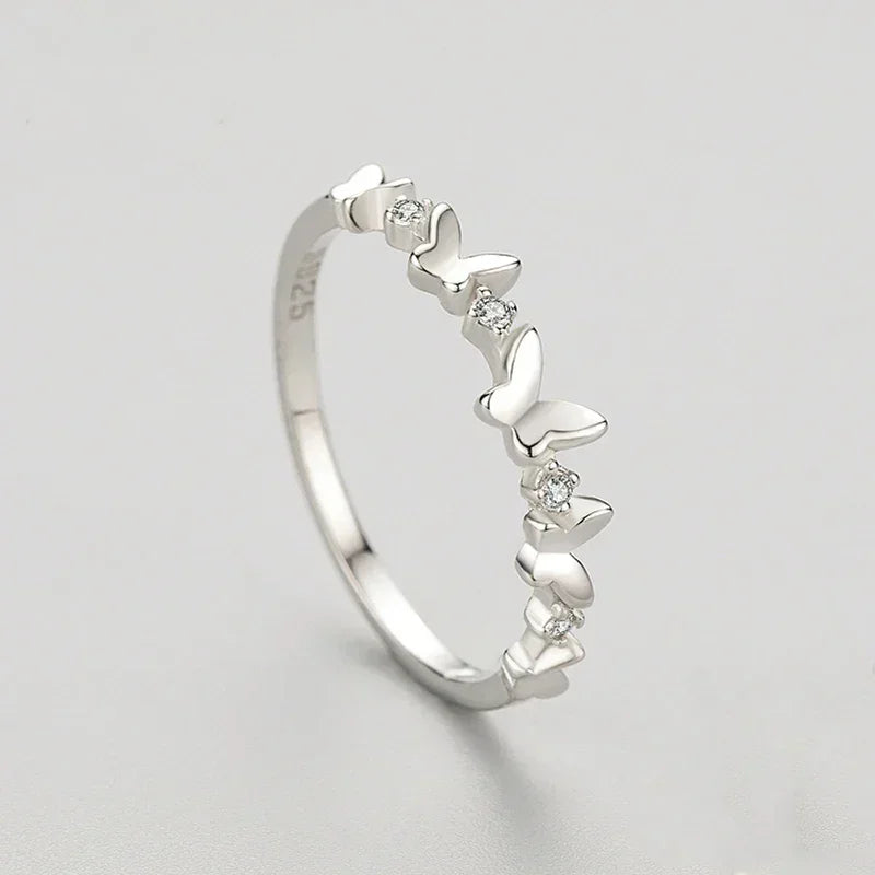 925 silver butterfly ring with small clear crystals on light background