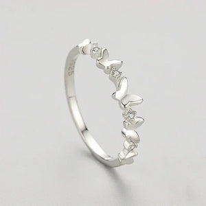 Butterfly Elegance Zircon Ring- TM & CO. JEWELS,butterfly zirconia ring crafted for women who wear elegance with quiet, effortless grace, on a plain background.