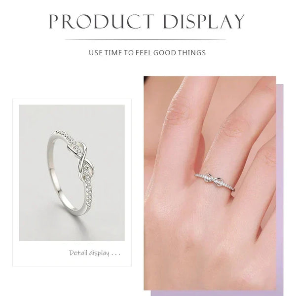 925 sterling silver infinity ring with cubic zirconia accents on white background