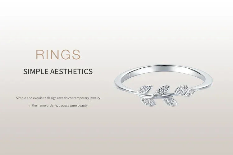 925 silver leaf ring with small diamonds, modern minimalist women’s jewelry on light background