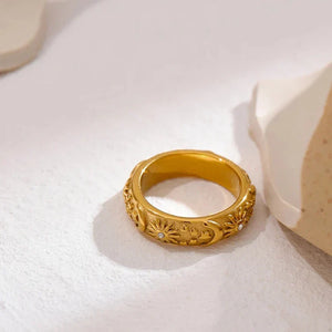 18K gold-plated ring with engraved sun, moon, and star motifs, accented with small crystals