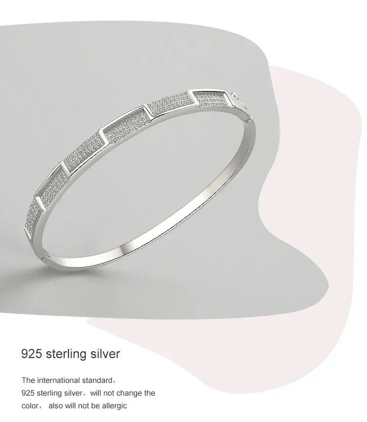 925 sterling silver geometric bangle bracelet with textured panels on neutral background