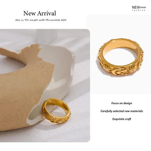 18K gold-plated ring with engraved sun, moon, and star motifs, accented with small crystals