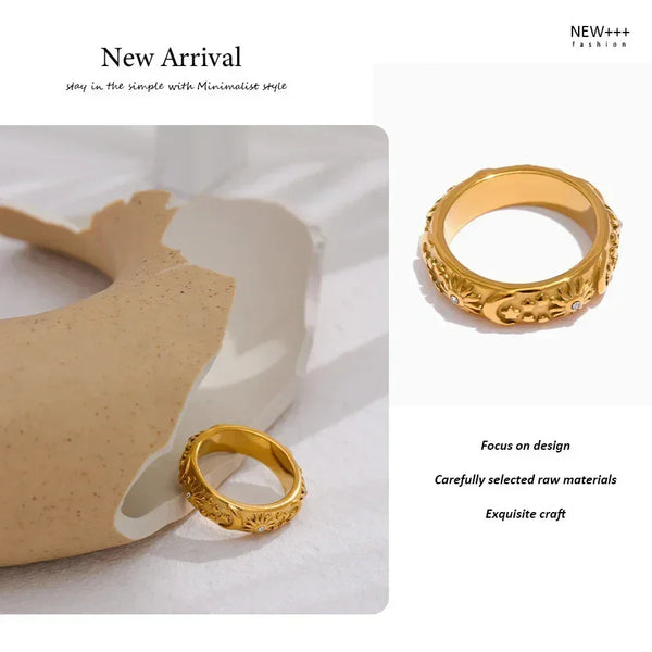 18K gold-plated ring with engraved sun, moon, and star motifs, accented with small crystals