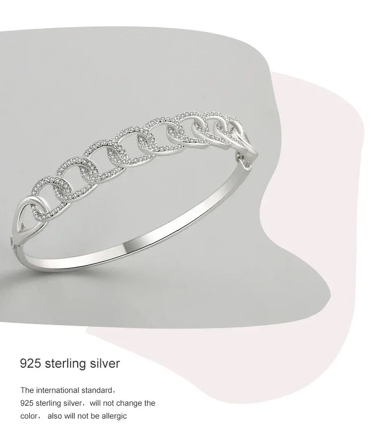 925 sterling silver chain link bangle bracelet with cubic zirconia on a minimalist background
