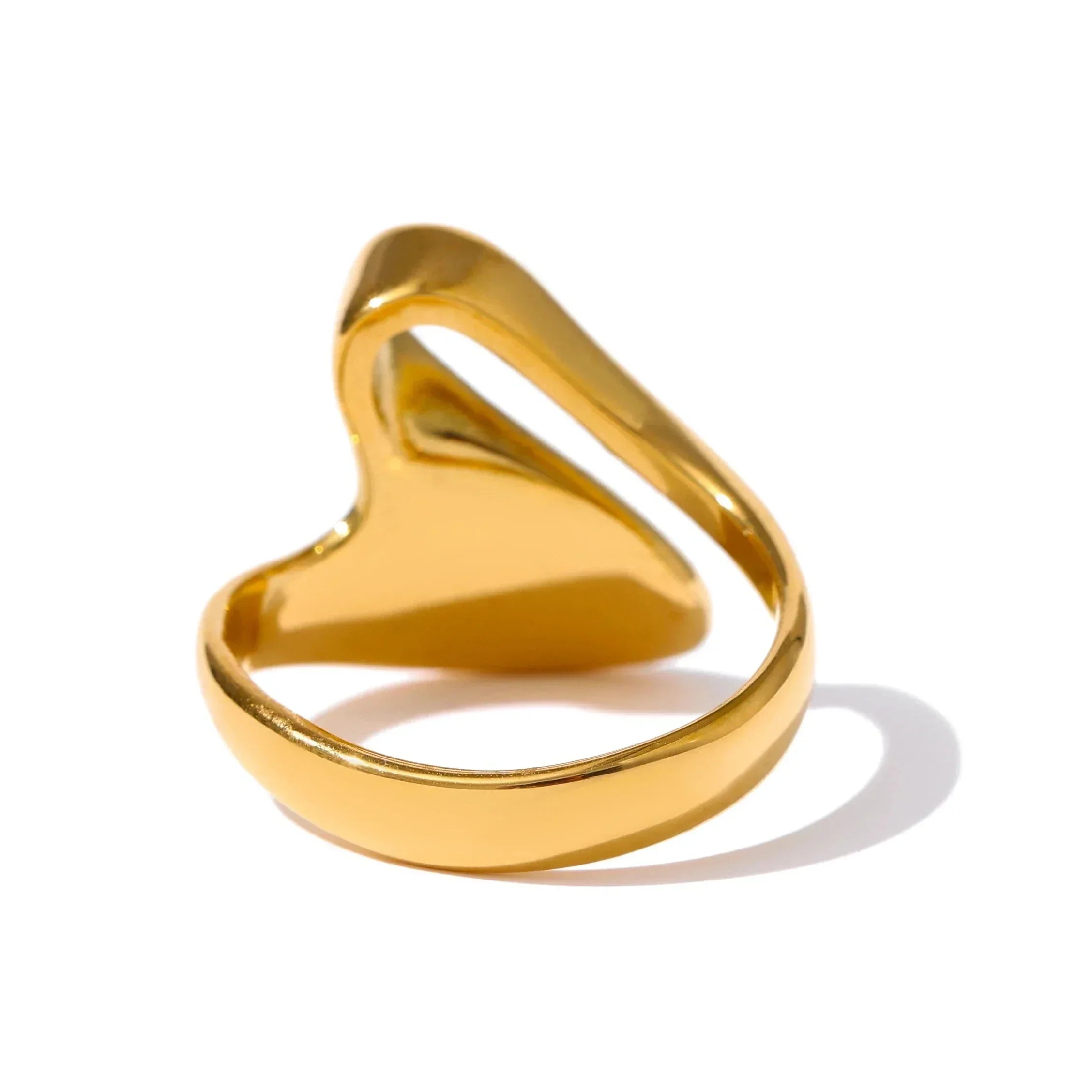 Gold-plated silver ring with open heart design on white background