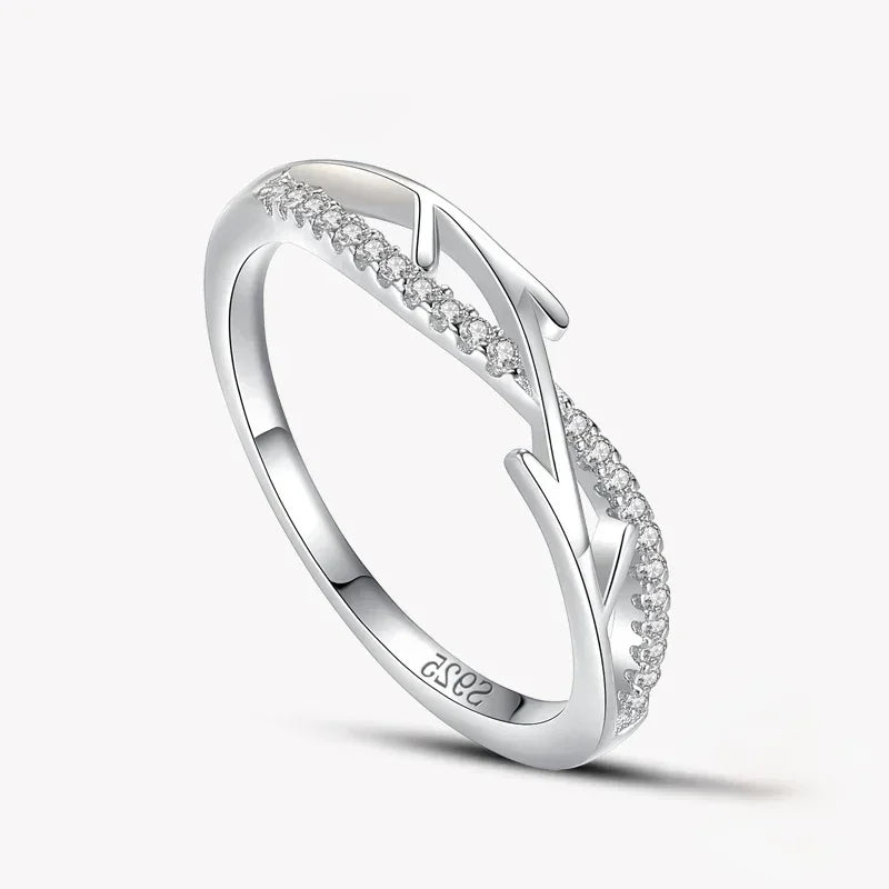 925 silver ring with leaf design and sparkling cubic zirconia accents on white background