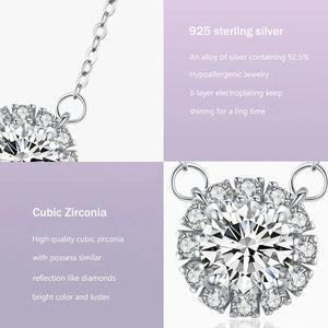 Silver necklace with a diamond pendant on a light gray background.