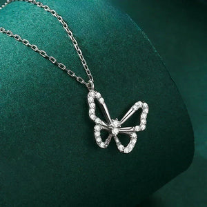 Silver butterfly pendant necklace on a green cushion-Butterfly Elegance Necklace - TM & Co. Jewels