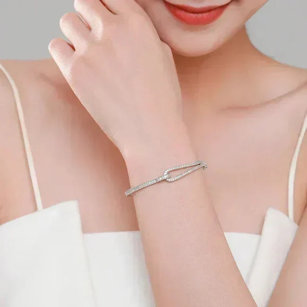 Crystal Maze Sterling Bracelet - TM & CO. JEWELS -Silver bracelet on a person's wrist with a neutral background.