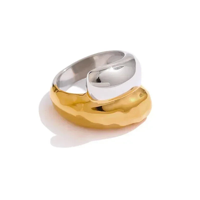 Chunky two-tone ring with polished 925 silver and textured gold-plated design on white background