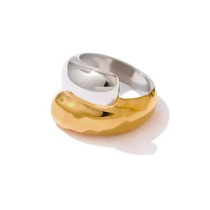 Two-toned gold and silver ring on a white background