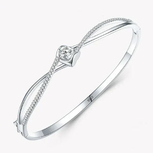 Elegant 925 silver bangle with heart-shaped centerpiece and sparkling cubic zirconia accents